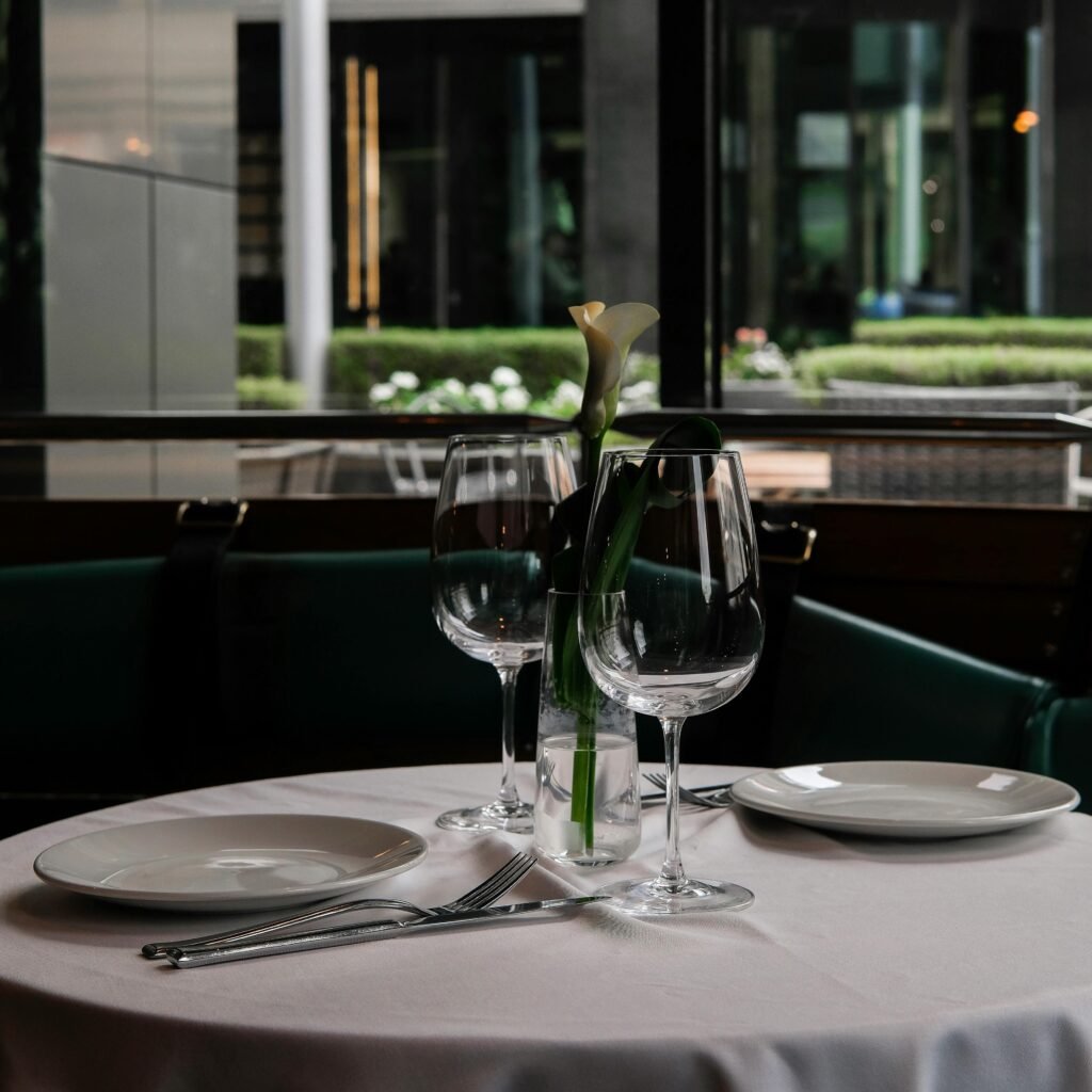 Elegant table setup with calla lily centerpiece in a modern Moscow restaurant.